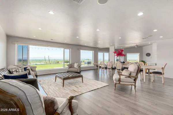 a living room with furniture and a large window
