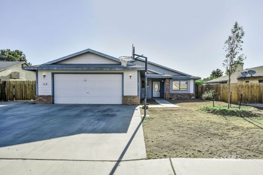 407 South Sunland Street Ridgecrest, CA 93555 - Photo 1 of 28 a view of a house with a yard