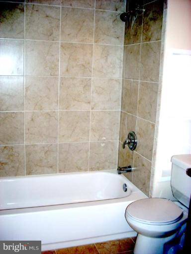 8715 Clydesdale Road Springfield, VA 22151 - Photo 16 of 19 a bathroom with a toilet and bathtub