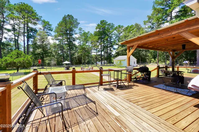 a view of swimming pool with chairs