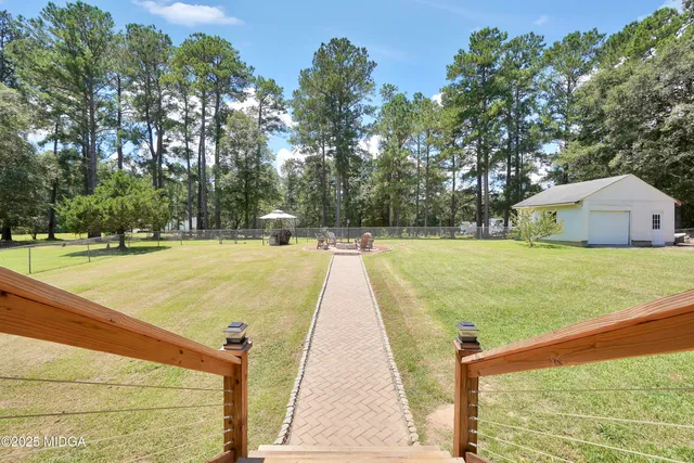 a view of swimming pool with a backyard