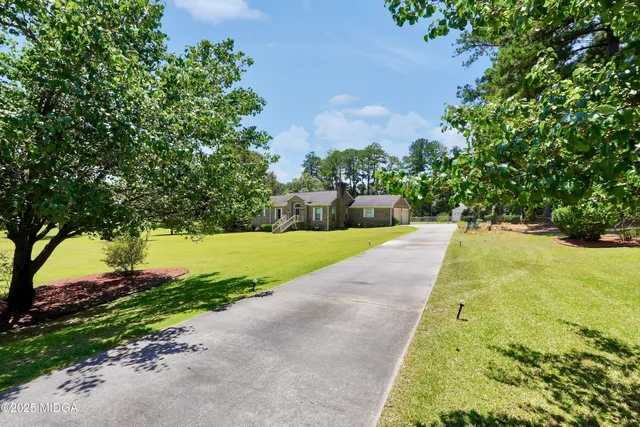 a view of swimming pool with a yard