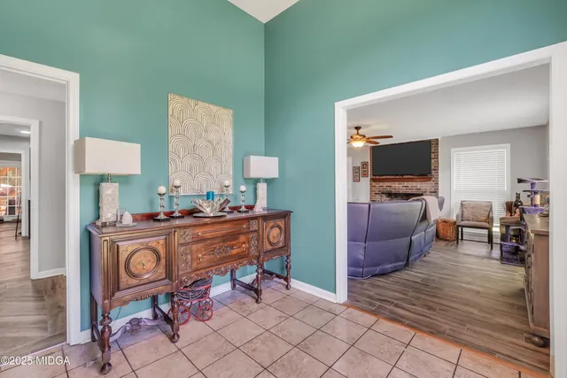 a room with furniture a rug and a wooden floor