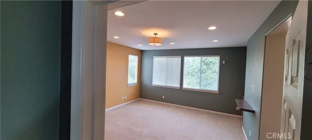 a view of a bathroom from a hallway