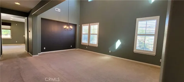 a open kitchen with stainless steel appliances granite countertop a stove and a refrigerator