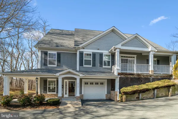 a front view of a house with garage