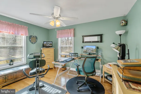 a view of a livingroom with furniture and a window