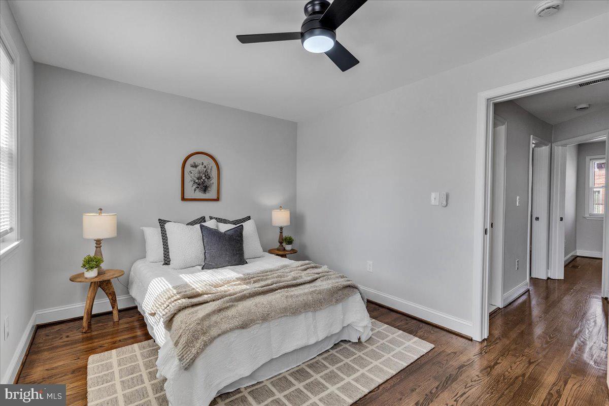 3908 Rokeby Road Baltimore, MD 21229 - Photo 12 of 28 a bedroom with a bed and wooden floor