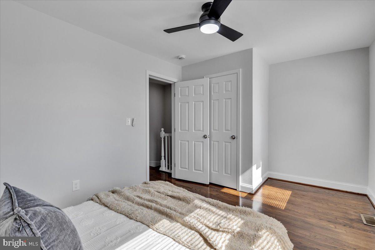 3908 Rokeby Road Baltimore, MD 21229 - Photo 14 of 28 a bedroom with a bed and a chandelier
