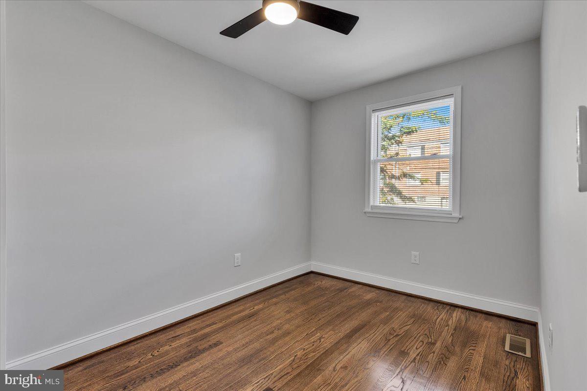 3908 Rokeby Road Baltimore, MD 21229 - Photo 17 of 28 wooden floor in an empty room with a window