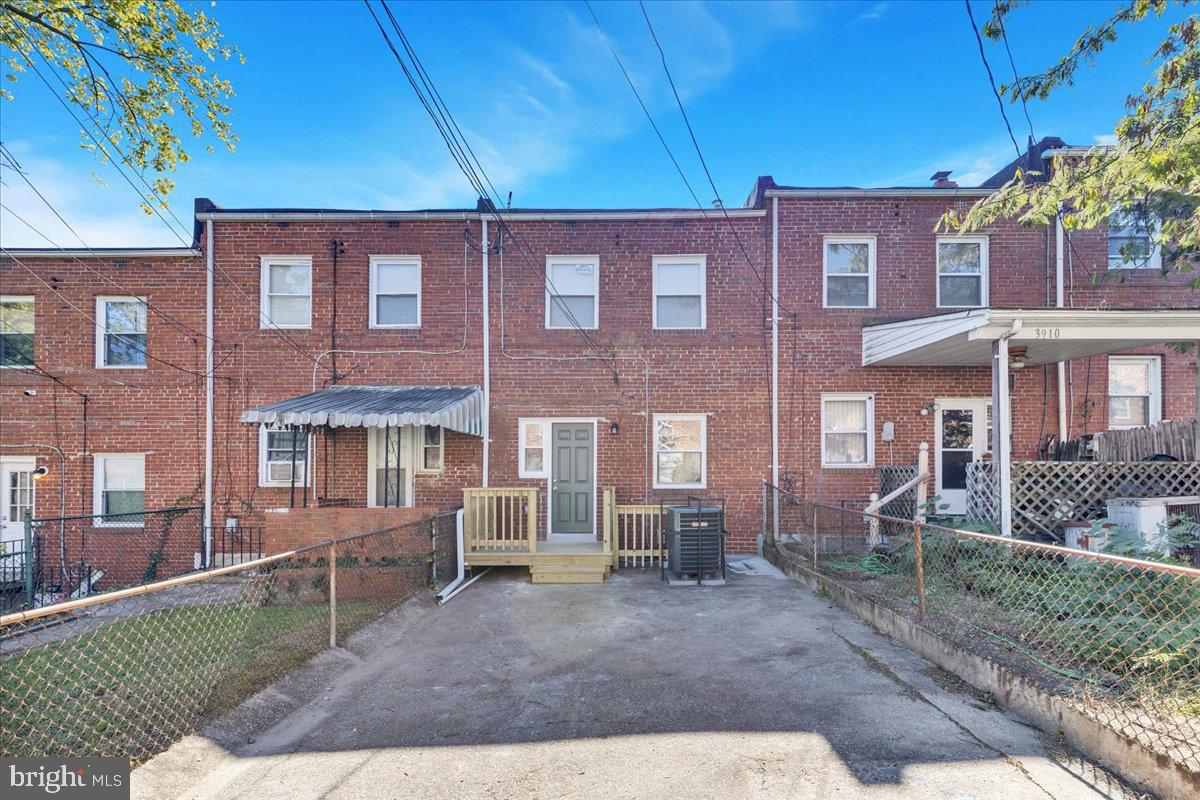 3908 Rokeby Road Baltimore, MD 21229 - Photo 26 of 28 a front view of a house with garden
