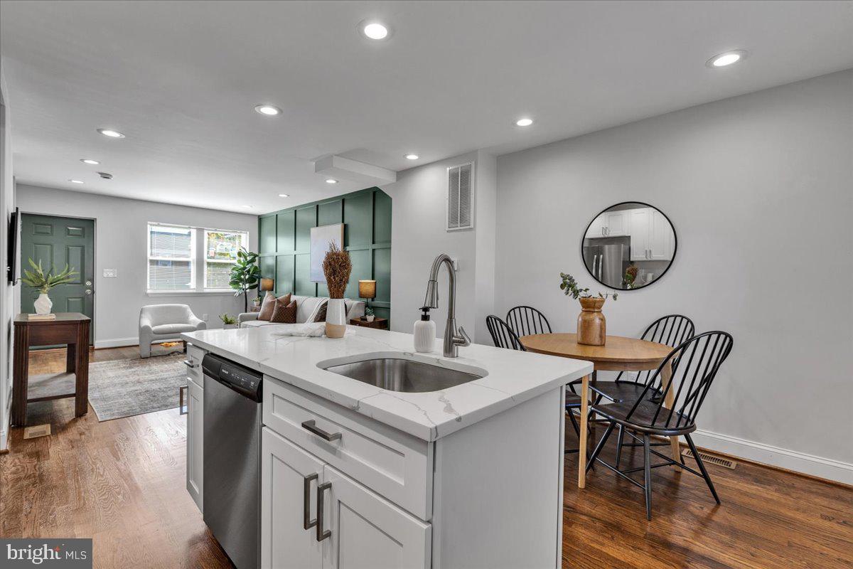 3908 Rokeby Road Baltimore, MD 21229 - Photo 8 of 28 a view of a dining room with furniture and wooden floor