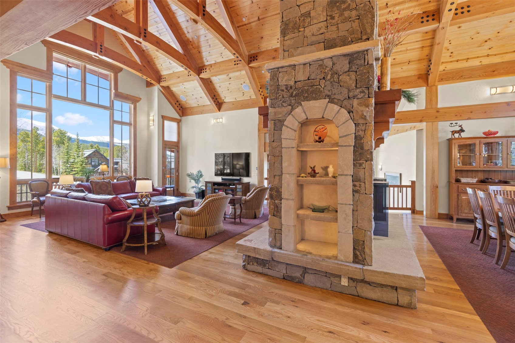 317 Timbertrail Road Breckenridge, CO 80424 - Photo 7 of 50 a living room with furniture a wooden floor and a fireplace
