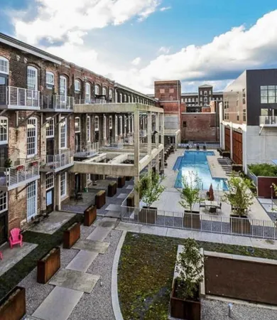 a front view of a building with potted plants