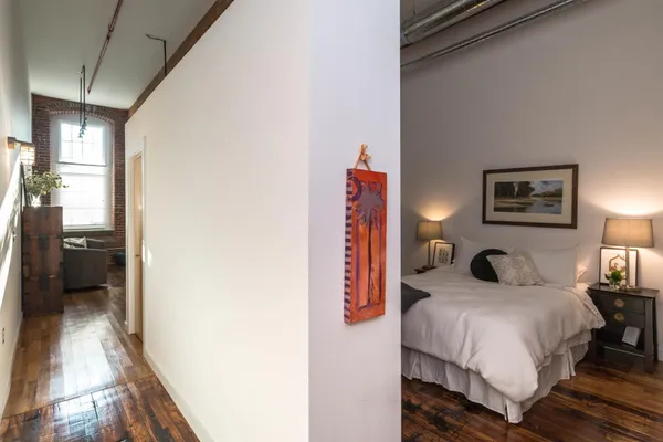 a bedroom with a bed and a view of bathroom