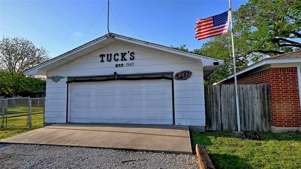 522 Montague Street Nocona, TX 76255 - Photo 18 of 25 a front view of a house with a yard
