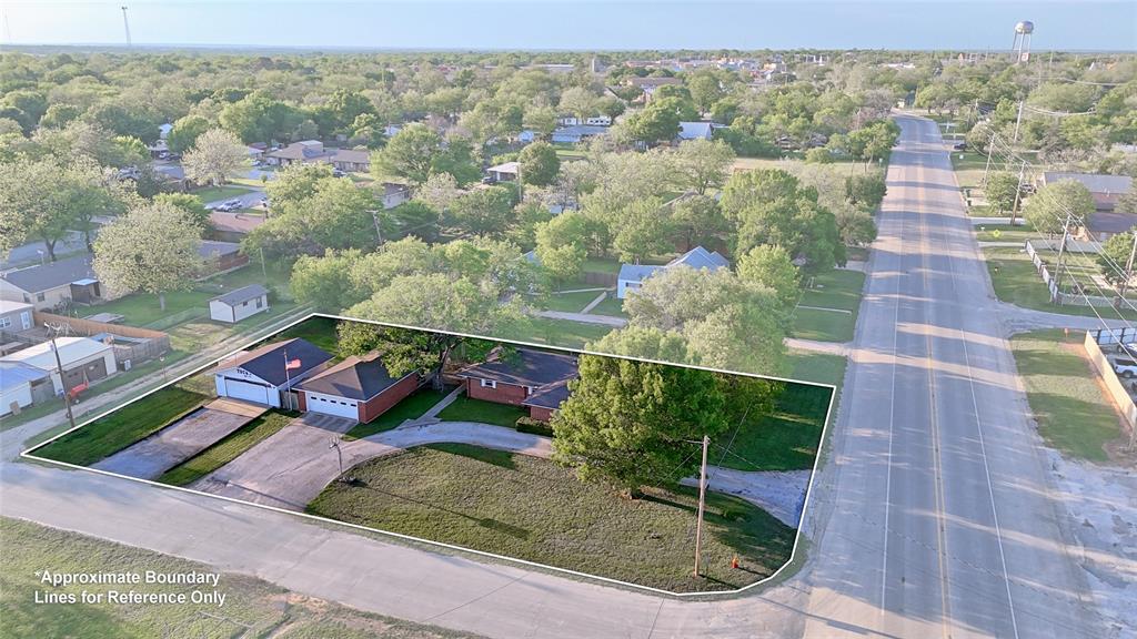 522 Montague Street Nocona, TX 76255 - Photo 25 of 25 a view of a yard with potted plants
