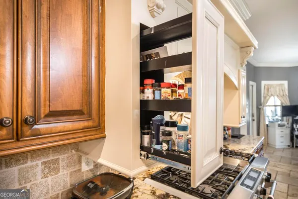 a room with lots of books and furniture