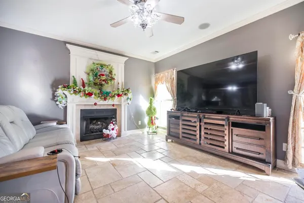 a living room with furniture and a flat screen tv