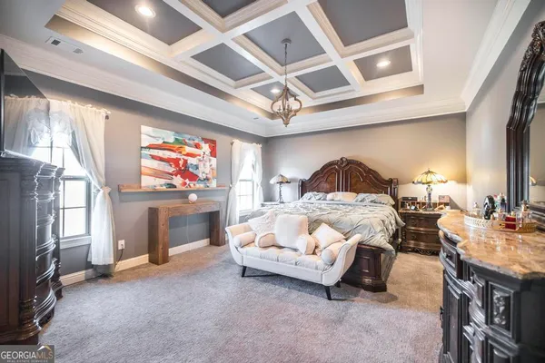 a bed room with a bed and a flat screen tv