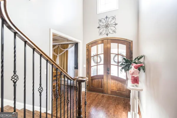 a view of an entryway with wooden floor