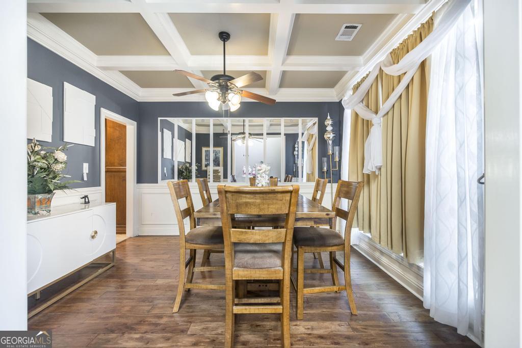 4065 Gordon Road Abbeville, GA 31001 - Photo 6 of 48 a view of a dining room with furniture wooden floor and chandelier