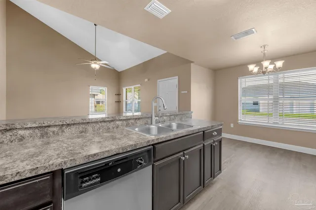 a kitchen with a sink and a window