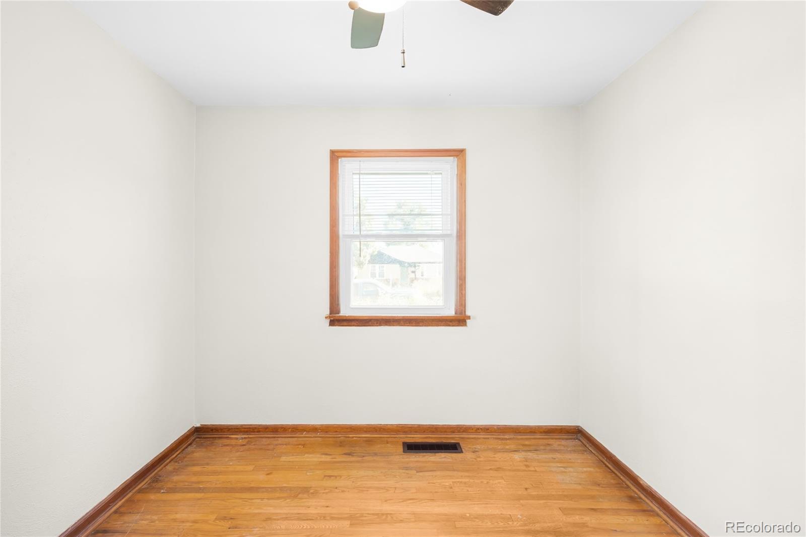3535 High Court Wheat Ridge, CO 80033 - Photo 12 of 26 a view of a room with wooden floor and a window