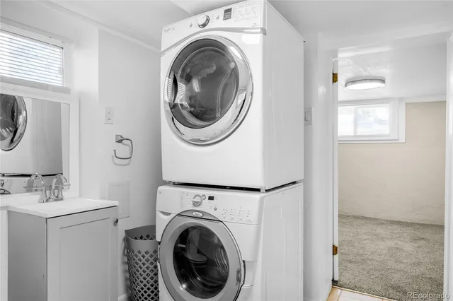a view of a hallway with washer and dryer