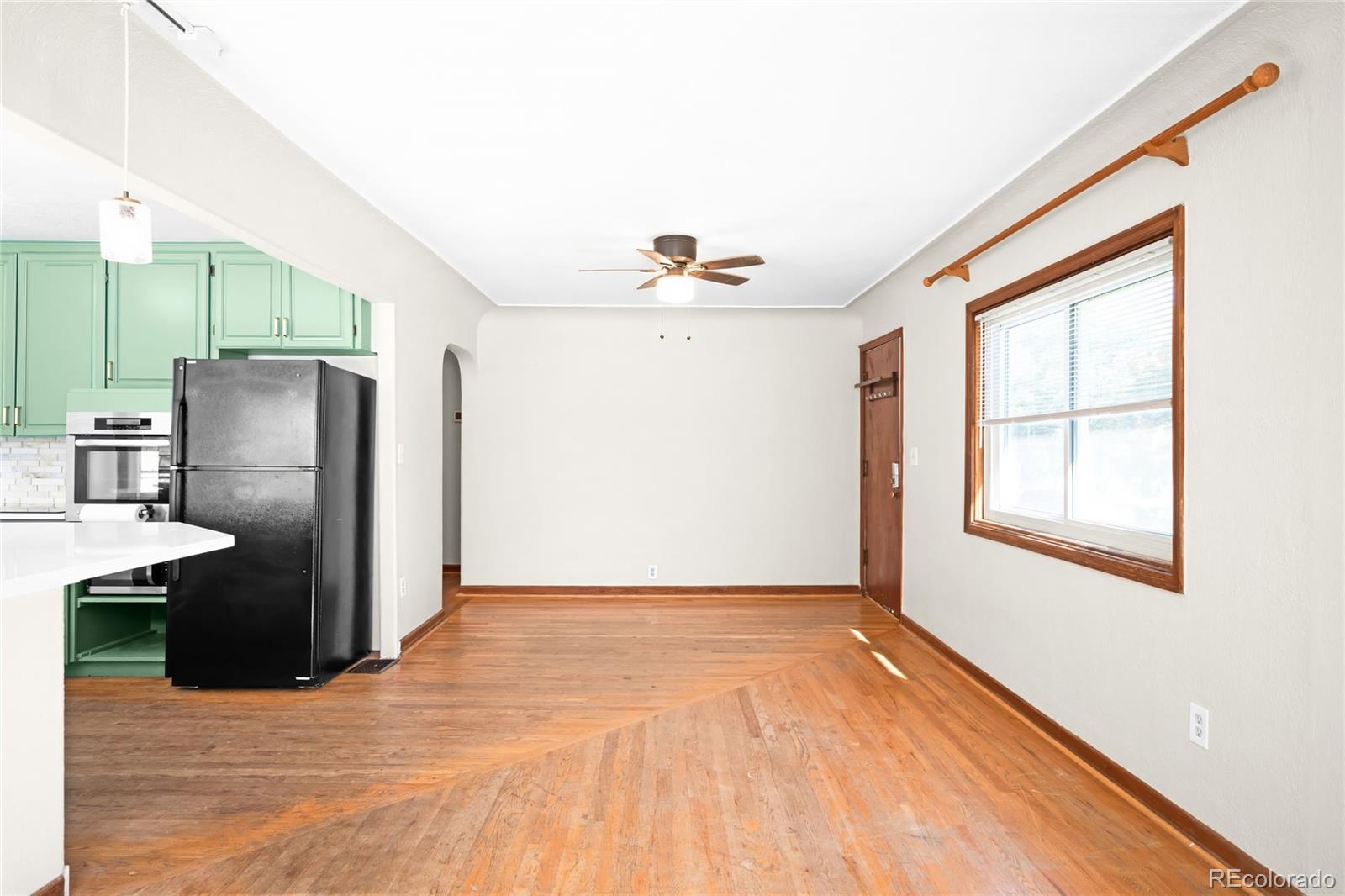 3535 High Court Wheat Ridge, CO 80033 - Photo 4 of 26 a view of kitchen with stainless steel appliances wooden floor and a window