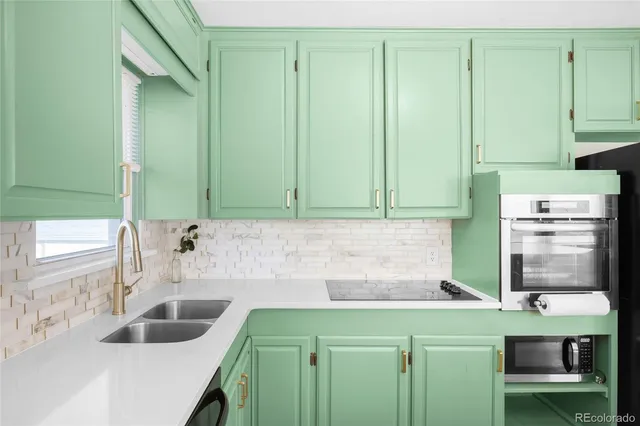 a kitchen with a sink and cabinets