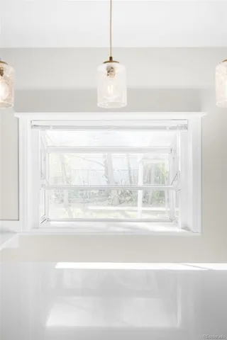 a bathroom with a bathtub and window