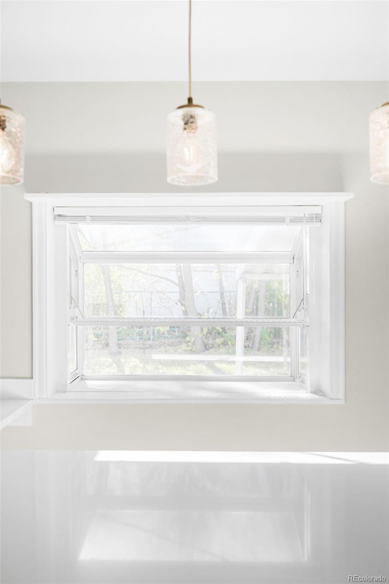 3535 High Court Wheat Ridge, CO 80033 - Photo 9 of 26 a bathroom with a bathtub and window