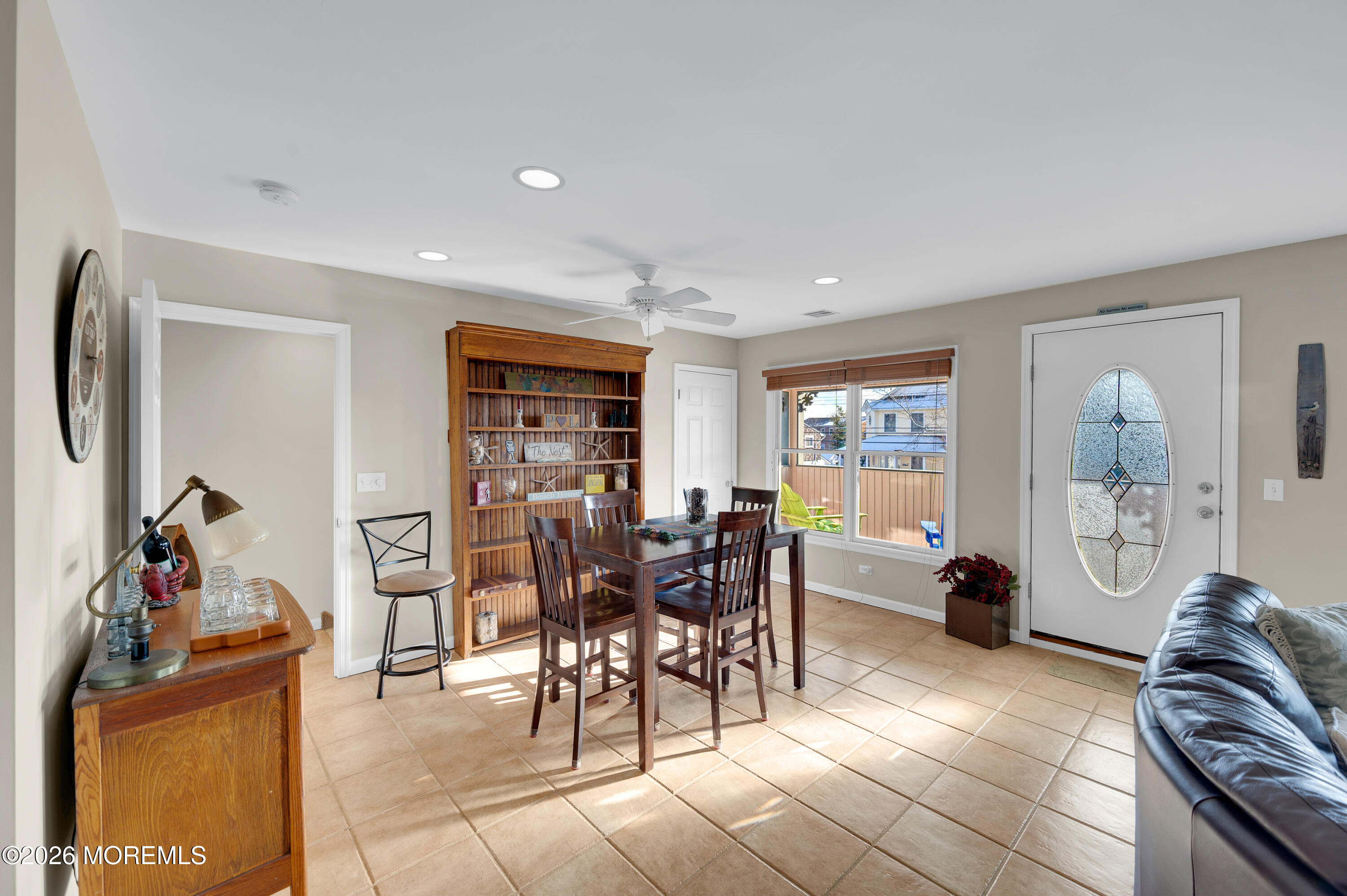 317 Carter Avenue Point Pleasant Beach, NJ 08742 - Photo 22 of 49 a living room with furniture a dining table and chairs