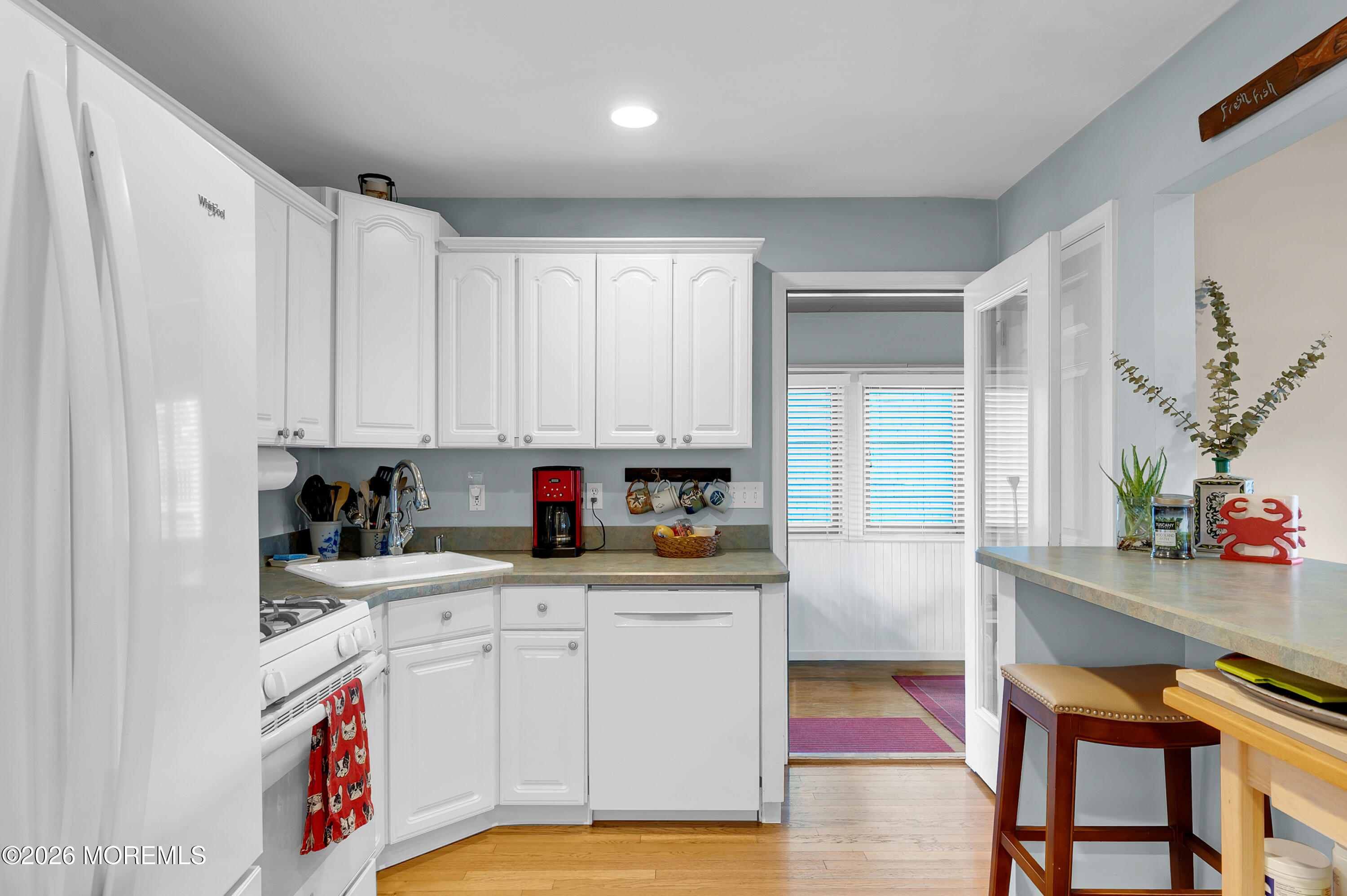 317 Carter Avenue Point Pleasant Beach, NJ 08742 - Photo 35 of 49 a kitchen with stainless steel appliances granite countertop a sink and cabinets