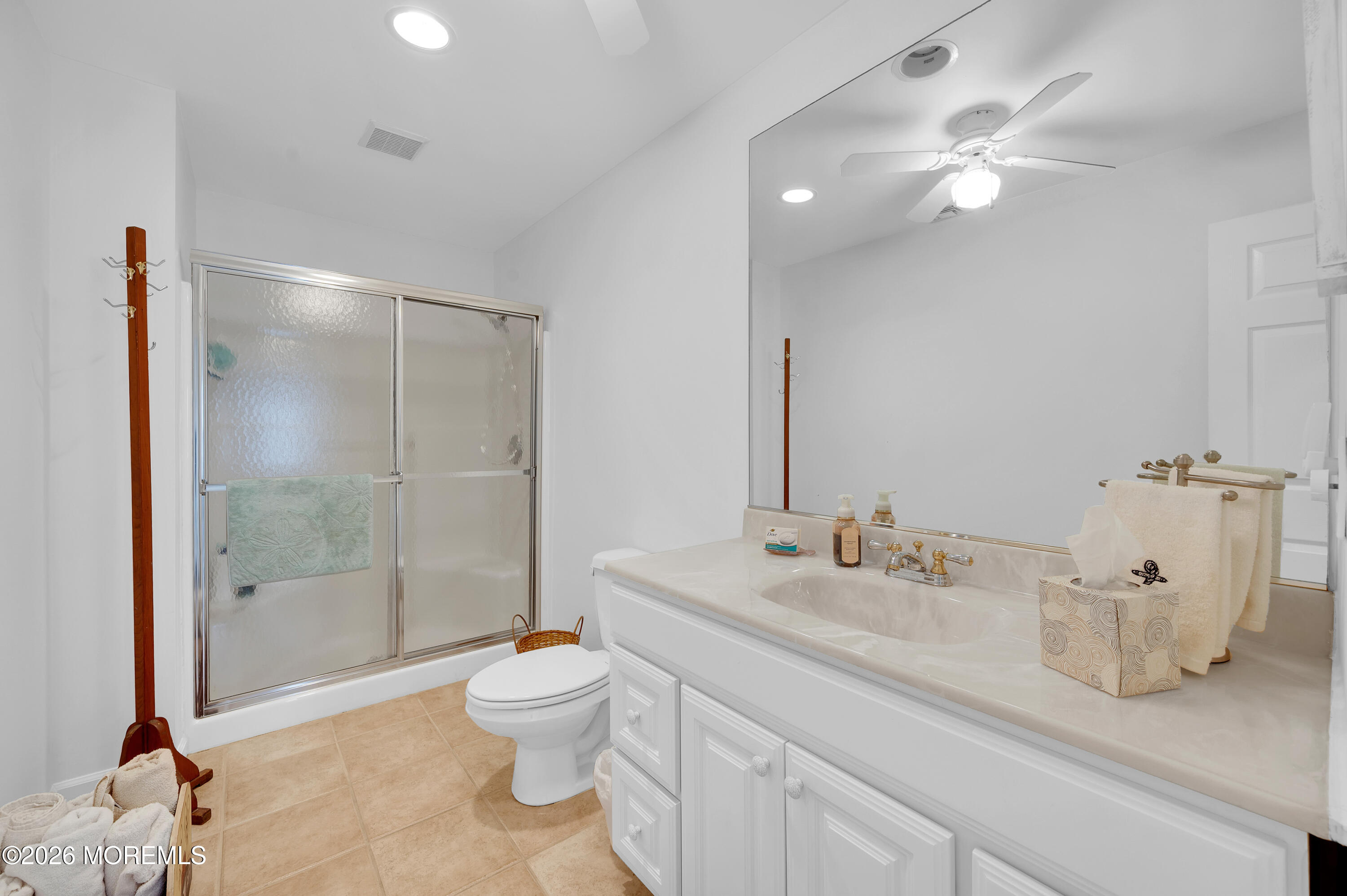 317 Carter Avenue Point Pleasant Beach, NJ 08742 - Photo 37 of 49 a bathroom with a sink a toilet and shower