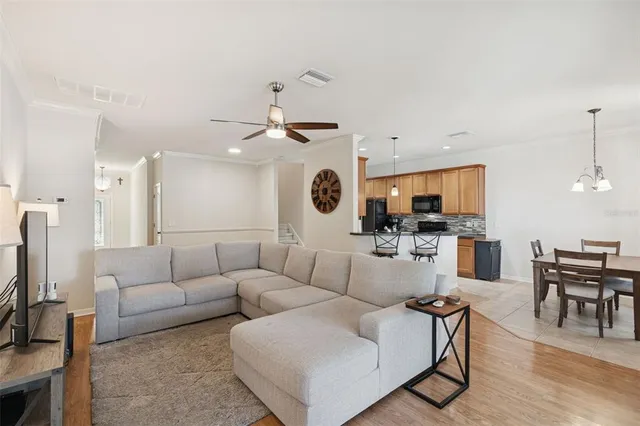 a kitchen with stainless steel appliances granite countertop a sink a stove and a refrigerator