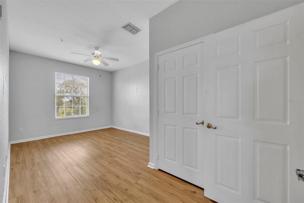 582 Brantley Terrace Way, Unit 304 Altamonte Springs, FL 32714 - Photo 20 of 30 wooden floor in an empty room with a window