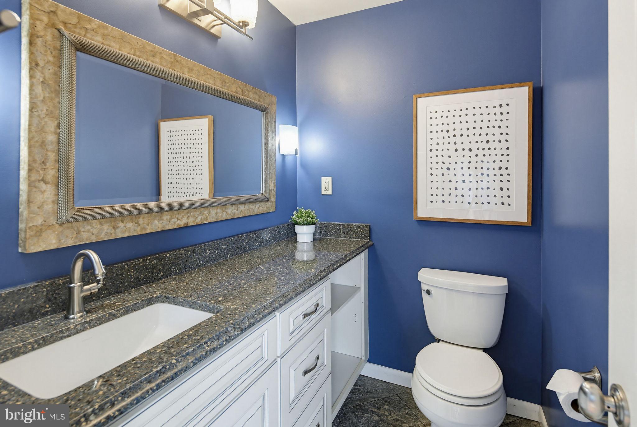 1124 Wynbrook Road Glen Burnie, MD 21060 - Photo 17 of 32 Chic bathroom with bold blue accents.