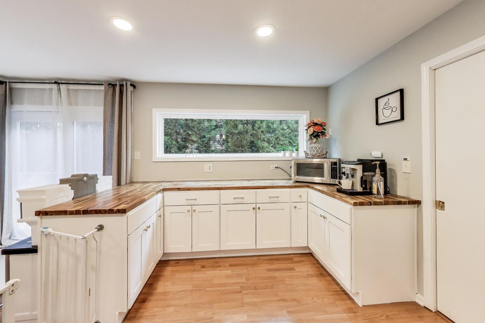 1344 Southwind Drive Northbrook, IL 60062 - Photo 12 of 39 a kitchen with stainless steel appliances granite countertop a sink and a cabinets