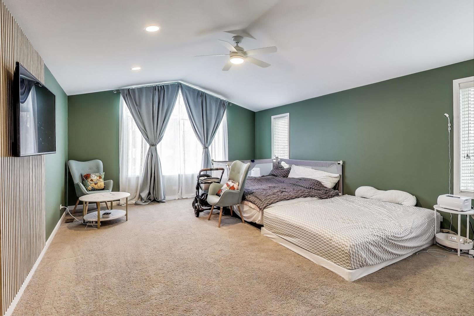1344 Southwind Drive Northbrook, IL 60062 - Photo 15 of 39 a spacious bedroom with two beds and a chair
