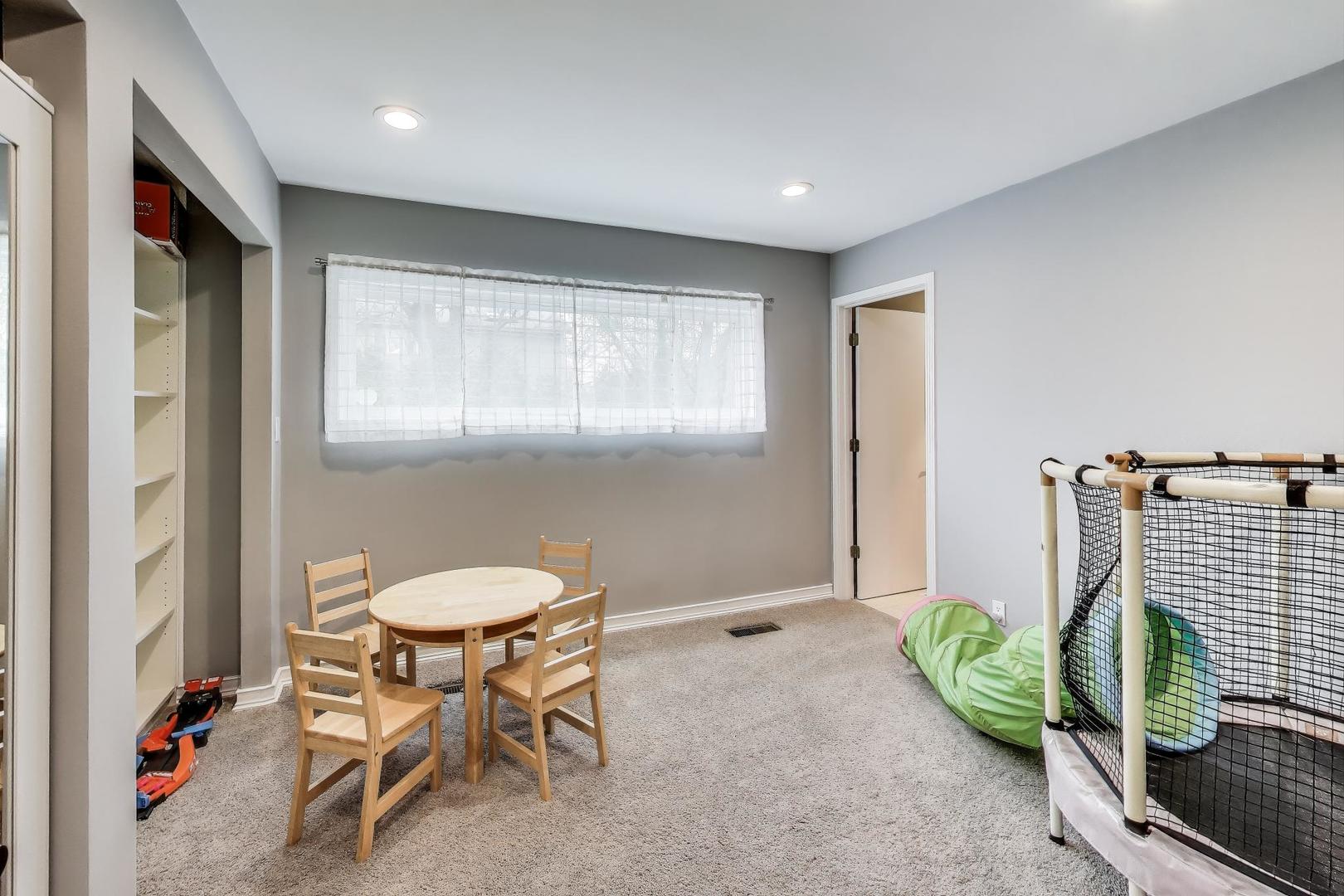 1344 Southwind Drive Northbrook, IL 60062 - Photo 19 of 39 a living room with furniture a window and a potted plant
