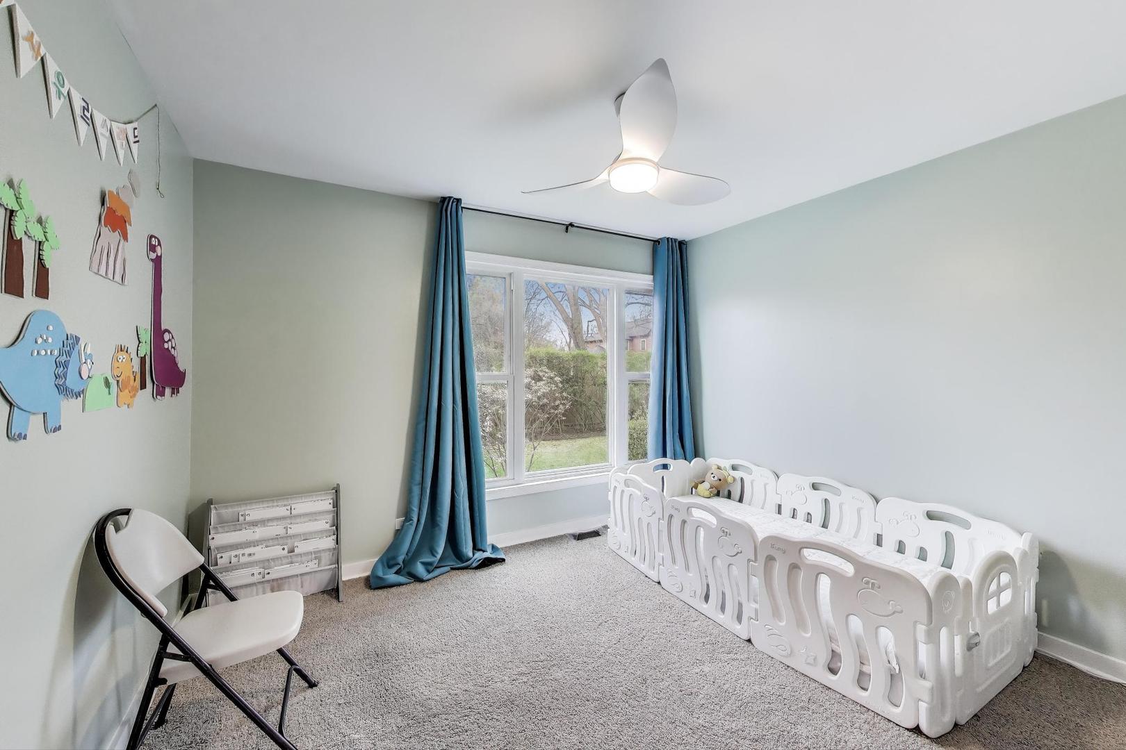1344 Southwind Drive Northbrook, IL 60062 - Photo 24 of 39 a living room with furniture and a large window