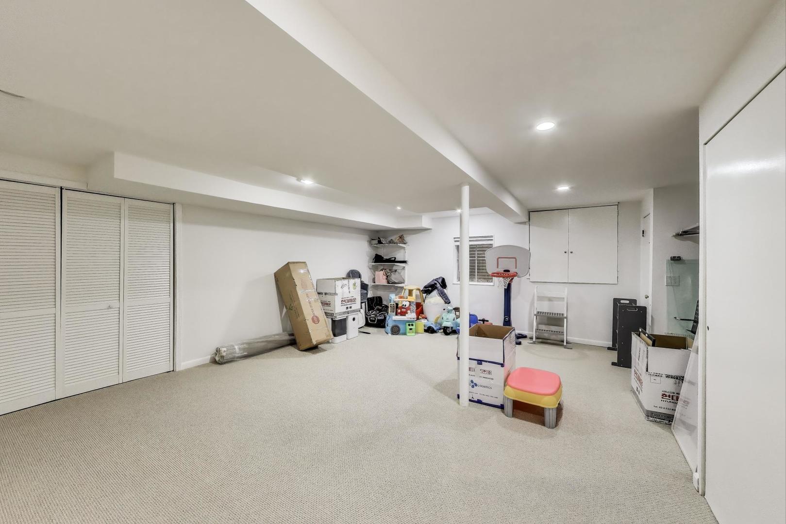1344 Southwind Drive Northbrook, IL 60062 - Photo 28 of 39 a view of a room with gym equipment and refrigerator