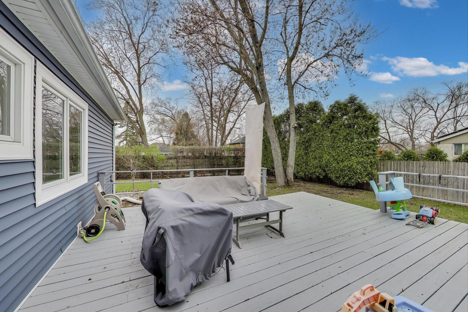 1344 Southwind Drive Northbrook, IL 60062 - Photo 30 of 39 a view of deck with furniture and garden