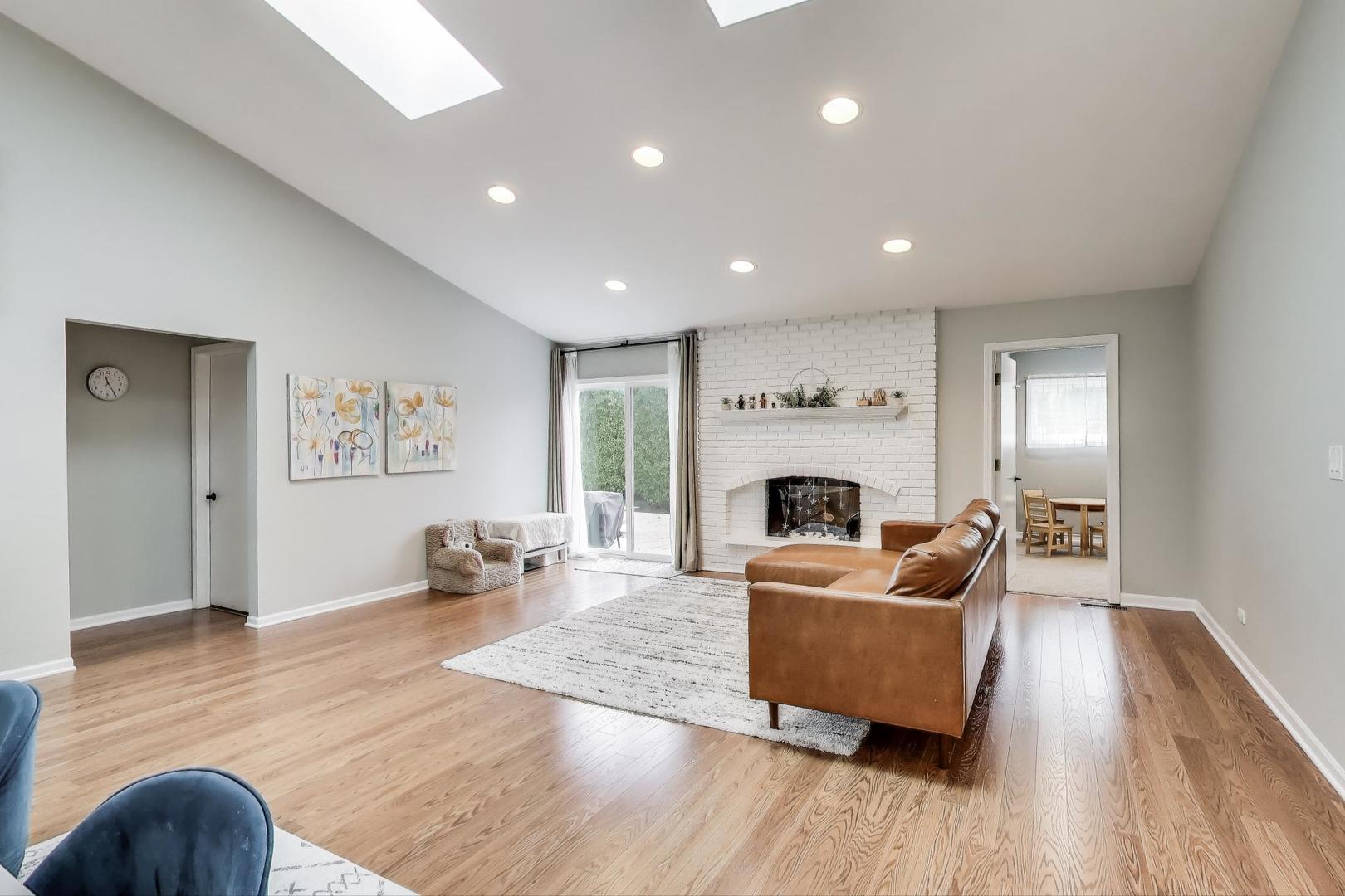 1344 Southwind Drive Northbrook, IL 60062 - Photo 6 of 39 a living room with furniture and a fireplace