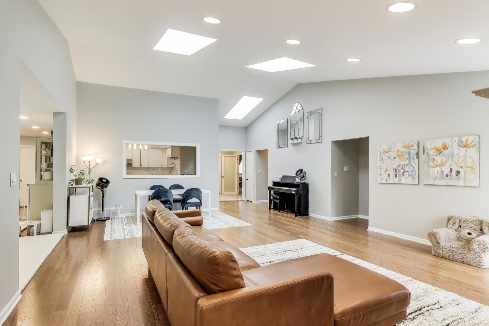 1344 Southwind Drive Northbrook, IL 60062 - Photo 8 of 39 a living room with fireplace furniture and a flat screen tv