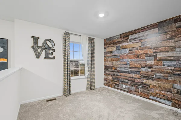 a view of an empty room with staircase