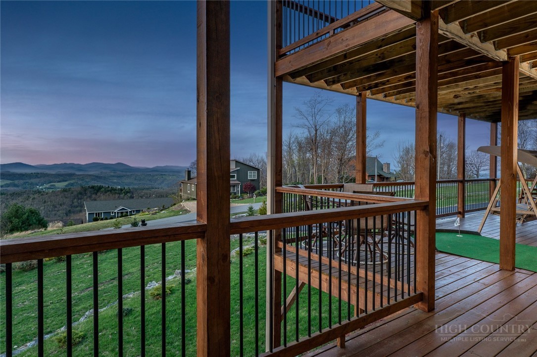 1161 Grandview Dr Extension Boone, NC 28607 - Photo 38 of 43 a view of a balcony with a floor to ceiling window with wooden fence