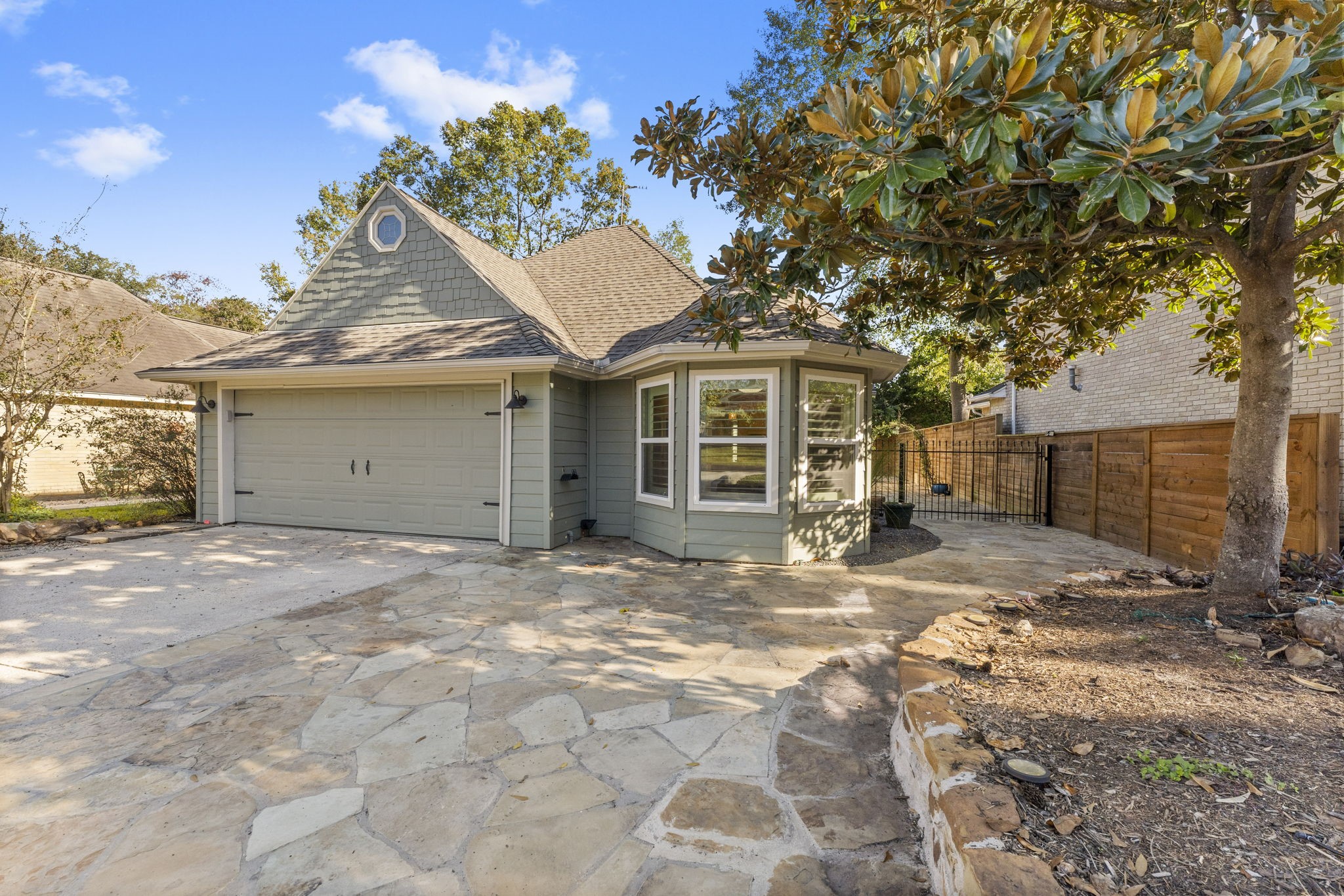 22 Shady Oak Lane Conroe, TX 77304 - Photo 1 of 44 a view of a house with a yard and garage